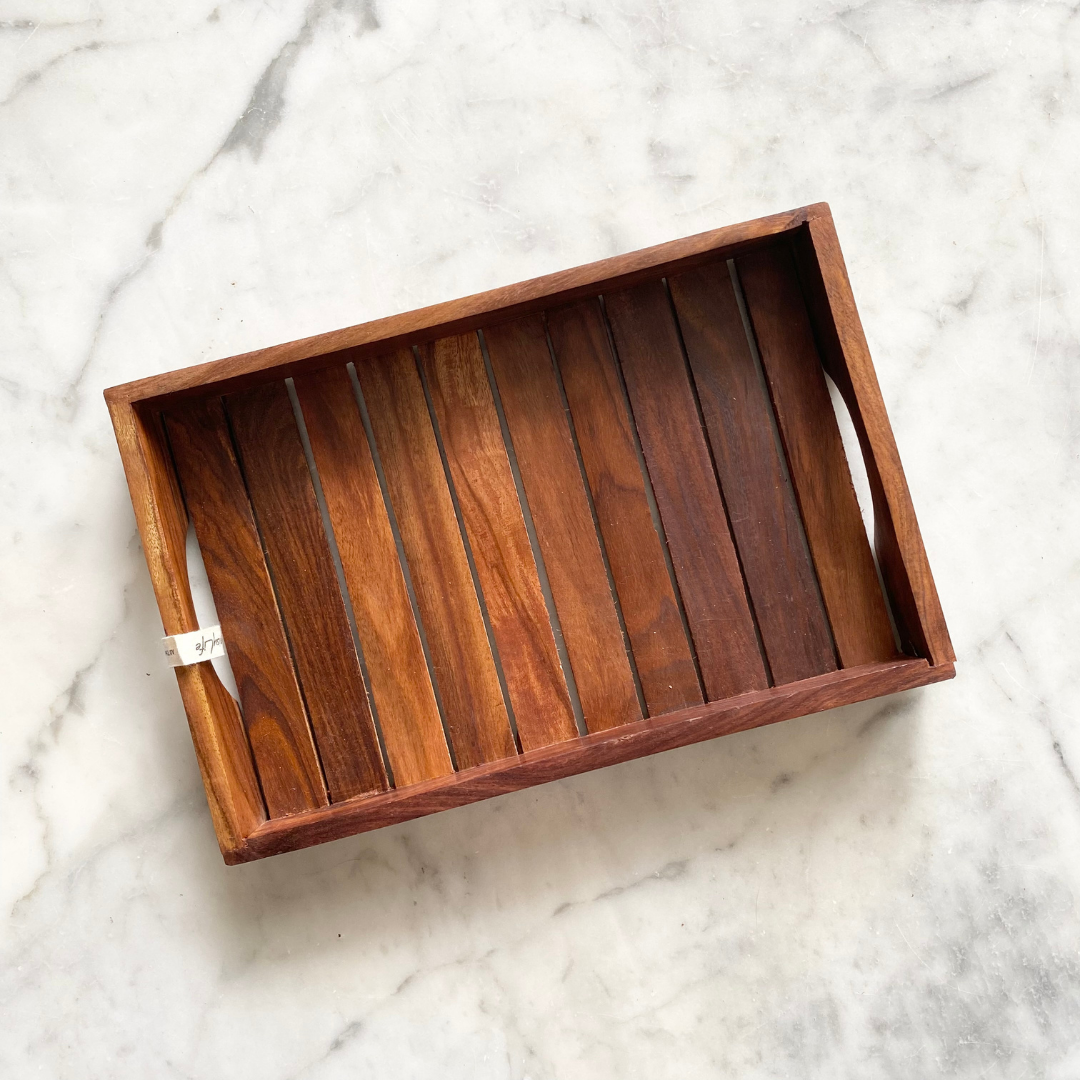 Dry fruits kept on beautiful dark wooden tray