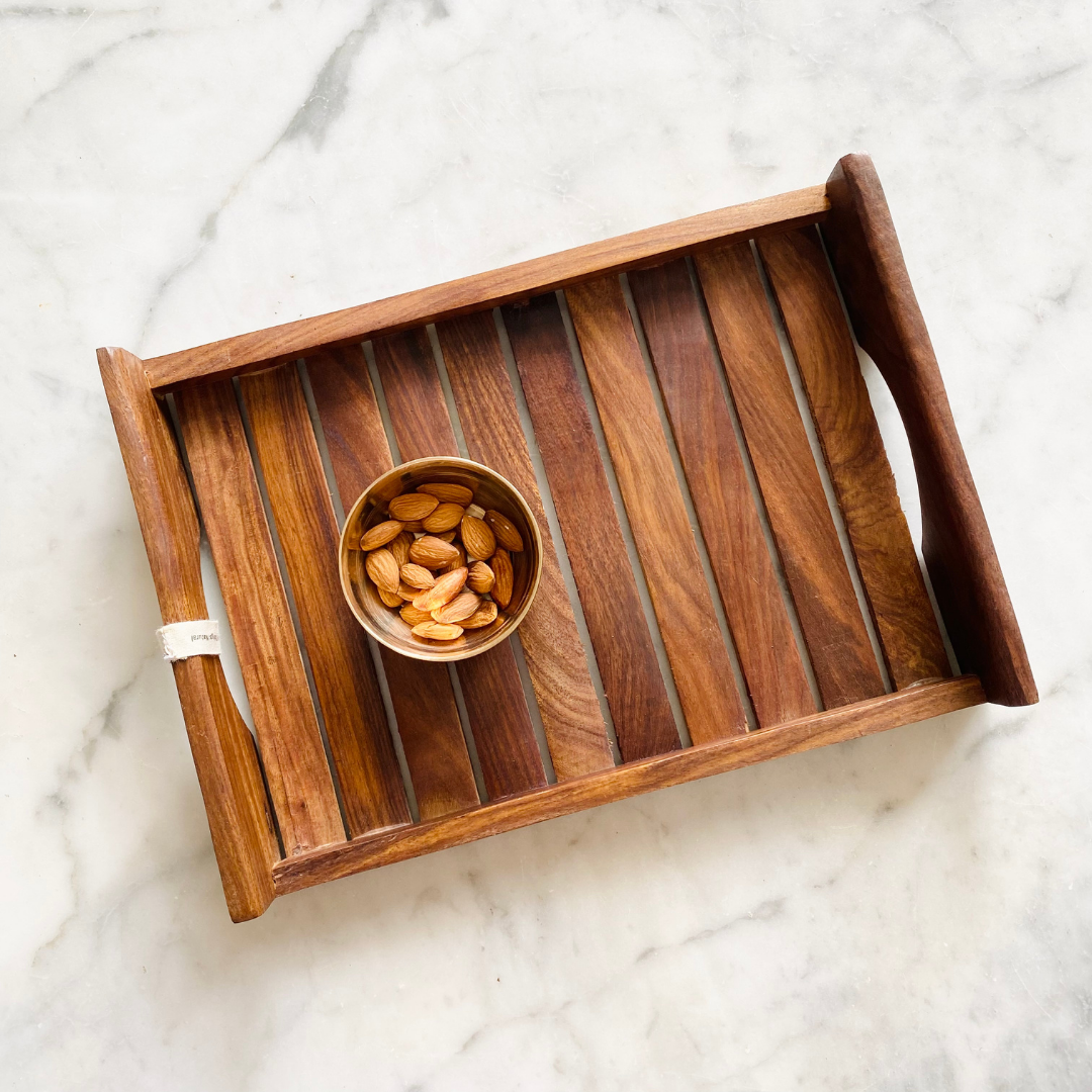 Almonds kept on Natural Wooden antique tray 