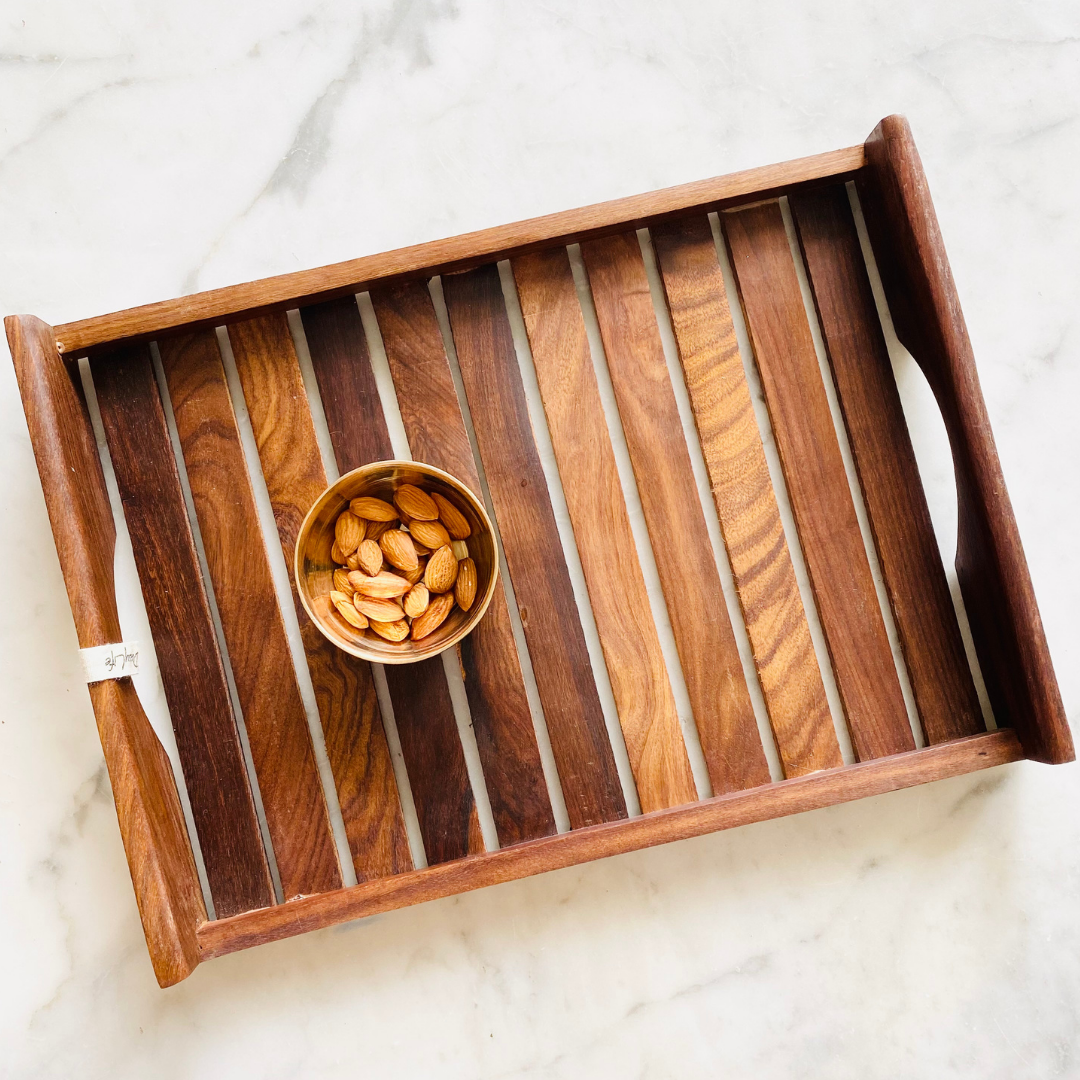 Almond kept on Natural Wooden antique tray.