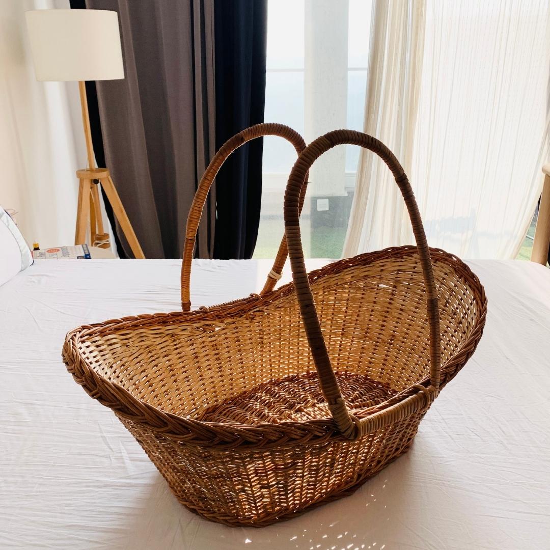 Cane hot sale baby basket